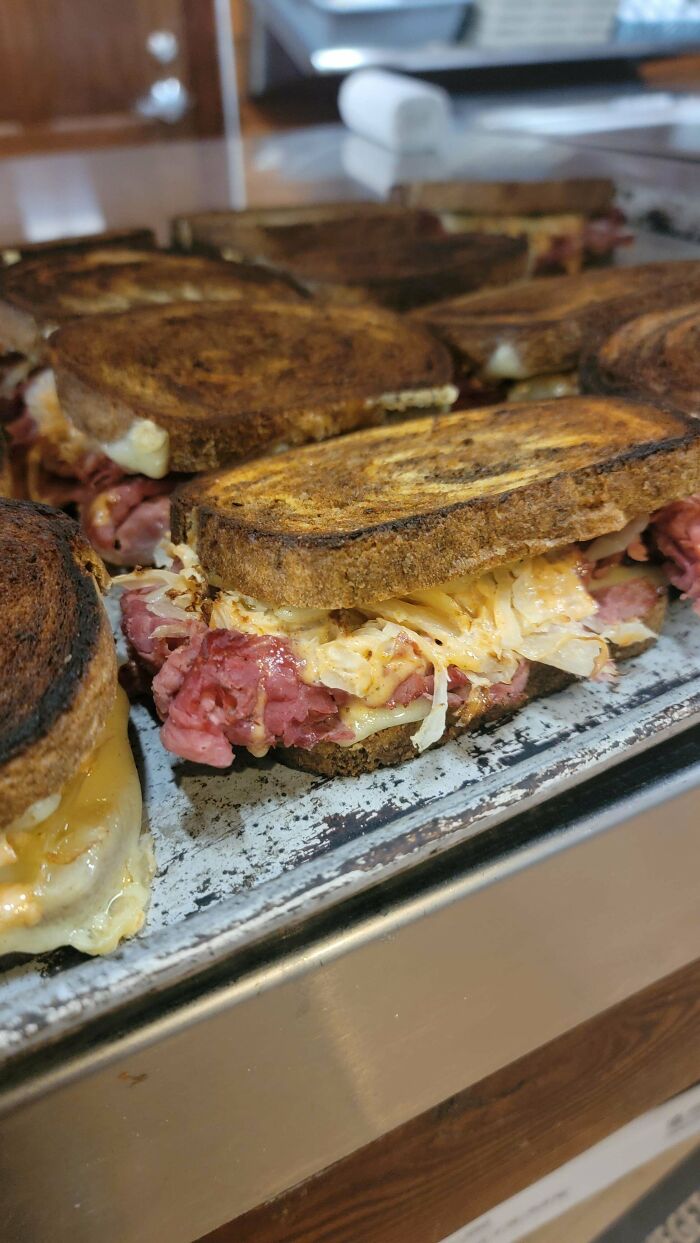 Grilled sandwiches filled with pastrami and cheese, popular in the food service industry.