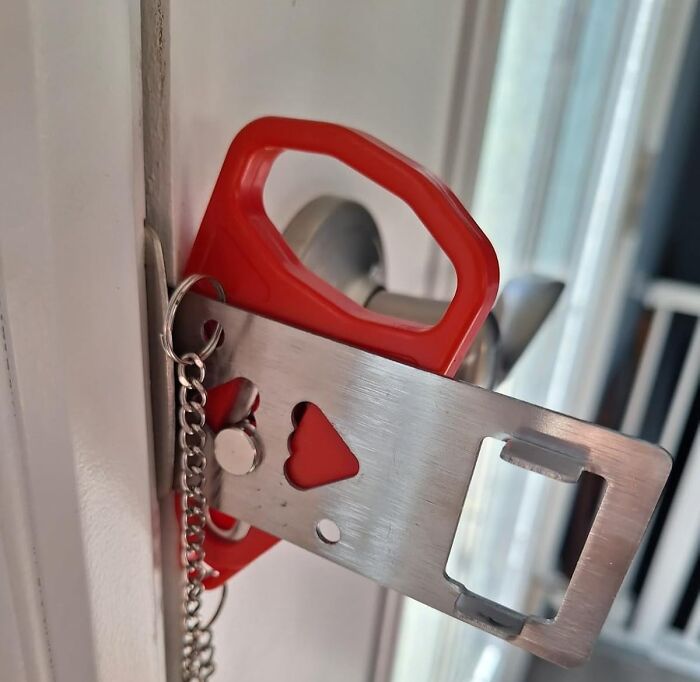 A portable door lock installed, ideal for minimalist travel and carry-on packing.