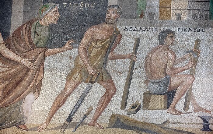 Ancient mosaic depicting inventors with tools, highlighting the theme of inventors and their creations.