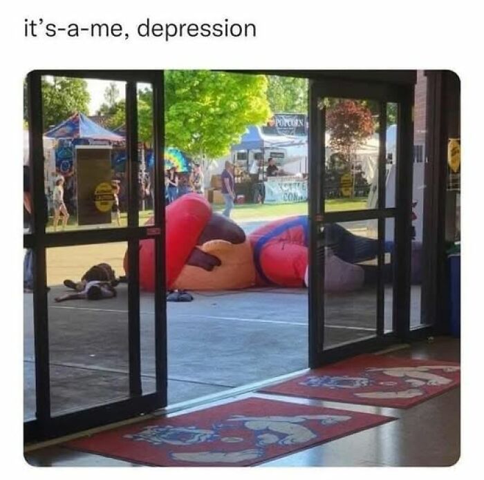 Inflatable character deflated outside, captioned "it's-a-me, depression," depicting mental health meme humor.