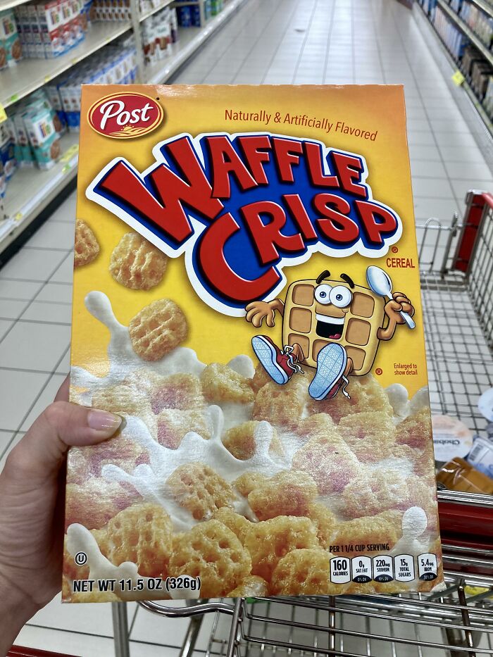 Waffle Crisp cereal box from the 90s and 2000s in a shopping cart.