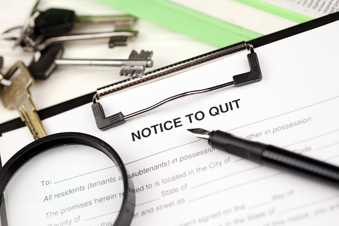 Notice to quit document with keys, symbolizing rent money issue and dissatisfaction with the system. Notice to quit document with keys, symbolizing rent money issue and dissatisfaction with the system.