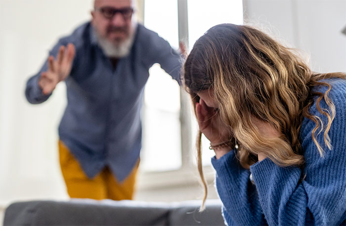 Father and daughter in a tense discussion about being a babysitter, highlighting parental conflict and boundaries.