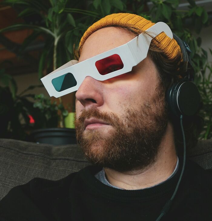 A person wearing 3D glasses and headphones, reflecting on "songs as ringtones" and nostalgic memories.