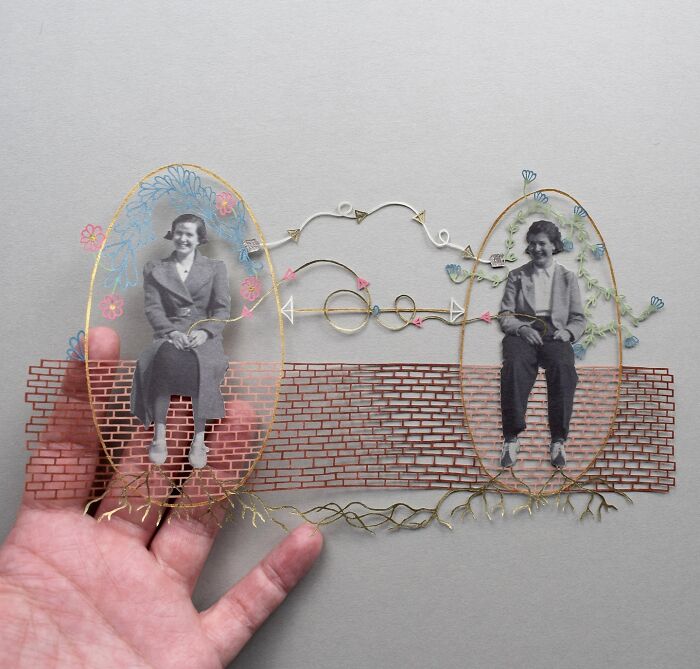 Intricate paper art design featuring two vintage portraits and colorful decorations by Pippa Dyrlaga.