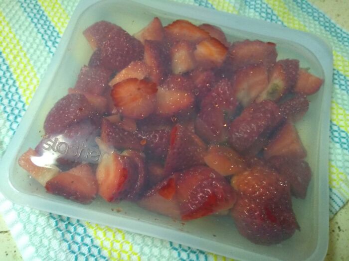 Container of strawberries in a reusable silicone bag, one of the Sharktank items.