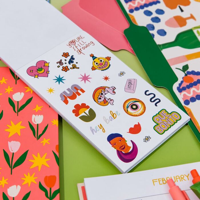 Colorful Bando stationery and stickers with vibrant patterns on a table.