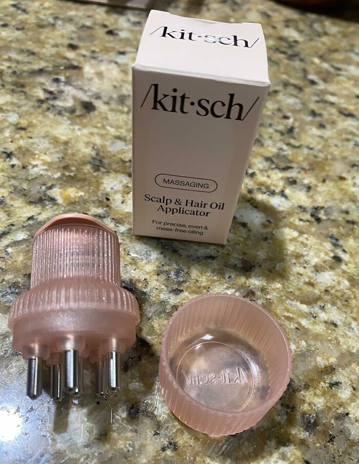 Scalp and hair oil applicator product on a countertop to simplify daily hair care.