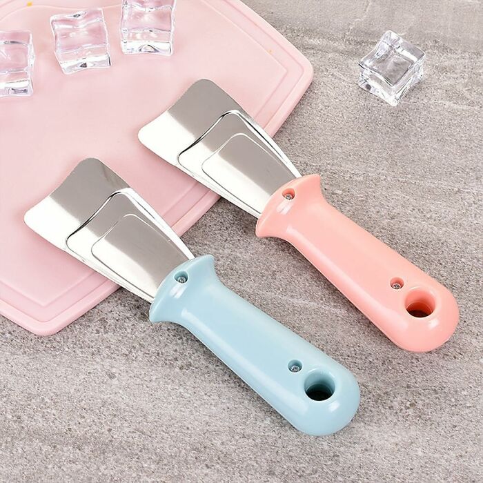 Colorful cleaning scrapers on a countertop, perfect tools for a spring cleaning headstart.