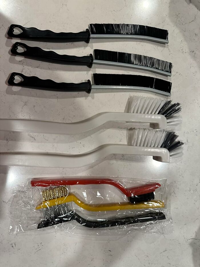 Assorted cleaning brushes on a countertop, ideal for a spring cleaning headstart.