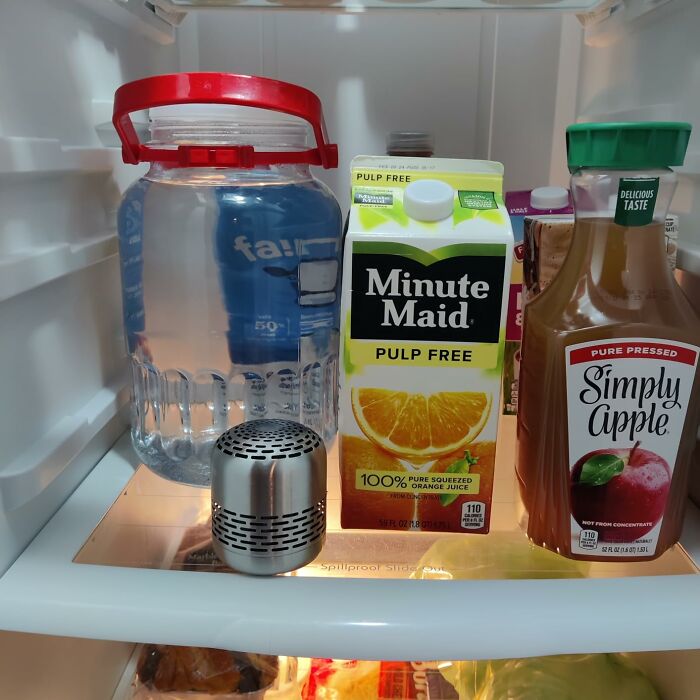 Fridge organized with drinks and a deodorizer for a spring cleaning headstart.