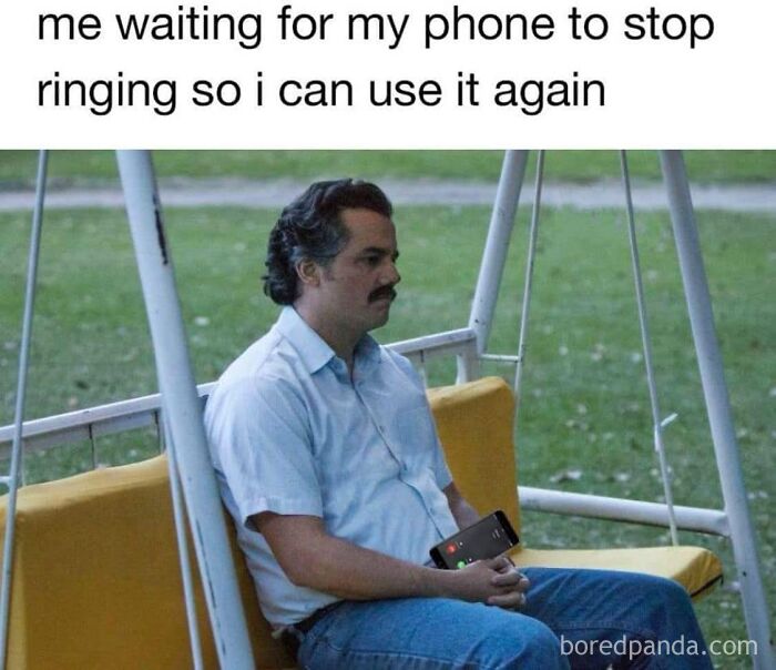 Man on a swing with a phone, showcasing dad humor waiting for a call to end.