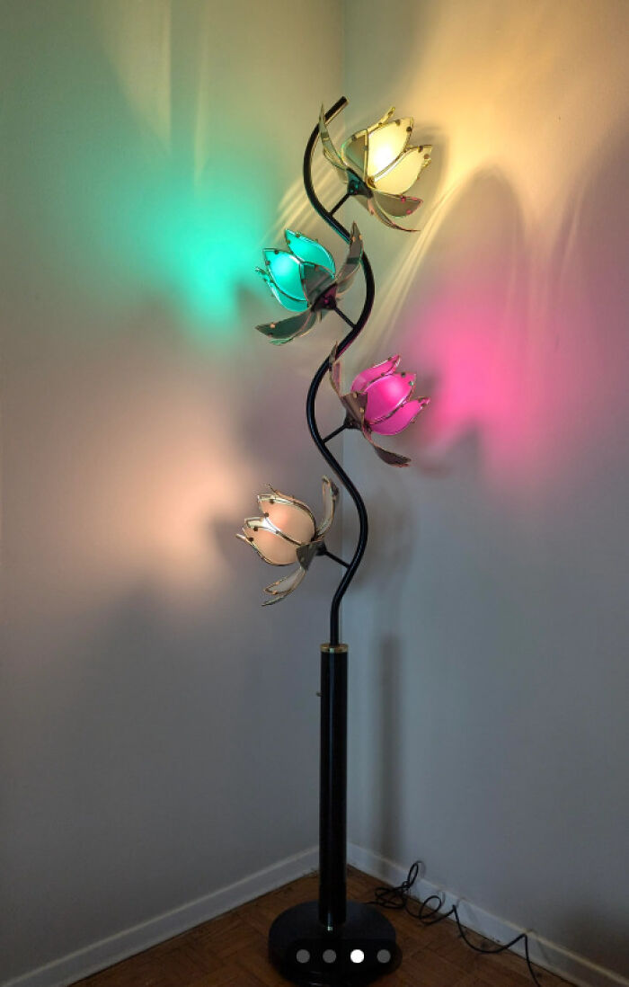 Colorful lotus-shaped floor lamp found while thrifting, featuring pink, green, and yellow glowing petals.