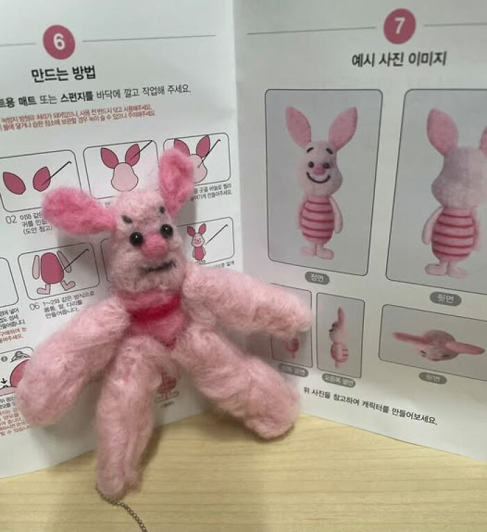 Unusual pink stuffed toy with instructions, showcasing a unique design.
