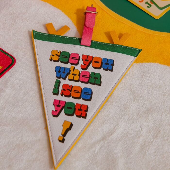 Colorful Bando pennant with the phrase "see you when I see you" on a textured background.