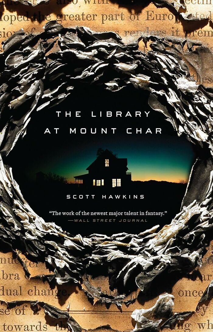 Weird but wonderful read: "The Library at Mount Char" book cover with a dark house and leafy wreath design.
