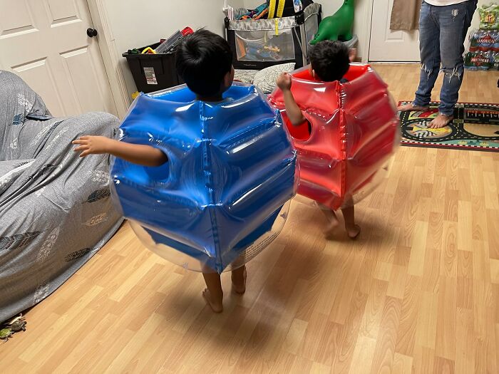 Kids playing in inflatable suits; fun gifts for aunts and uncles to give.