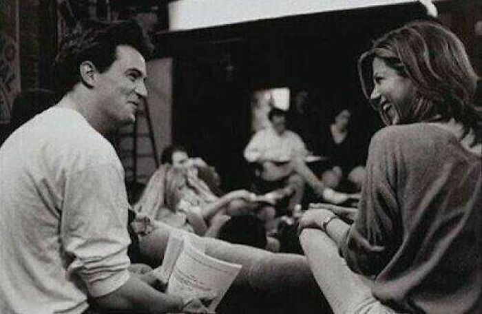 Two people sharing a joyful moment in a casual setting, capturing true happiness.