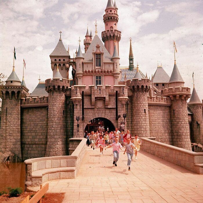 Children running joyfully from a castle, capturing true happiness in a magical moment.