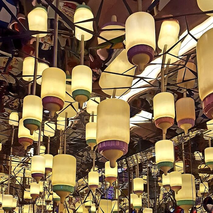 Unique ceiling lights resembling baby bottles in Japan, creating an interesting visual effect.