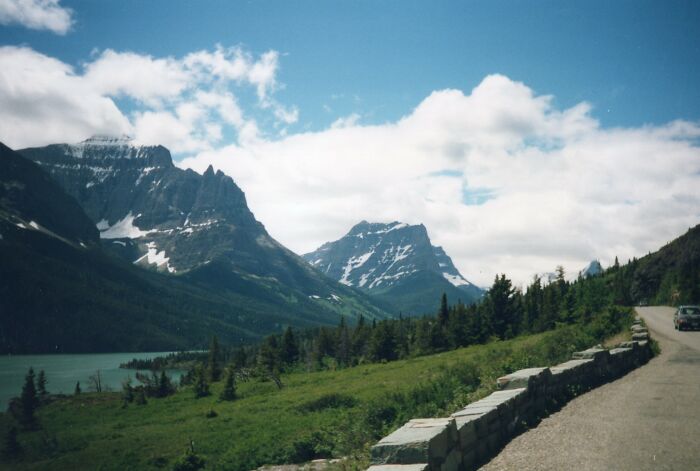 Scenic mountain view along a Legendary American road route with lush greenery and a clear sky.