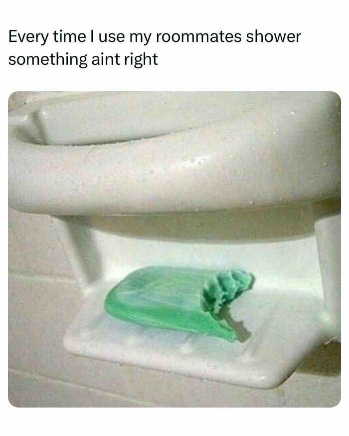 Green bar of soap with bite marks on a shower ledge, captioned with a funny college confession meme.