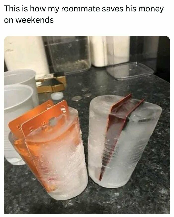 Frozen credit cards in cups, comically demonstrating a money-saving tactic. College confessions humor theme evident.
