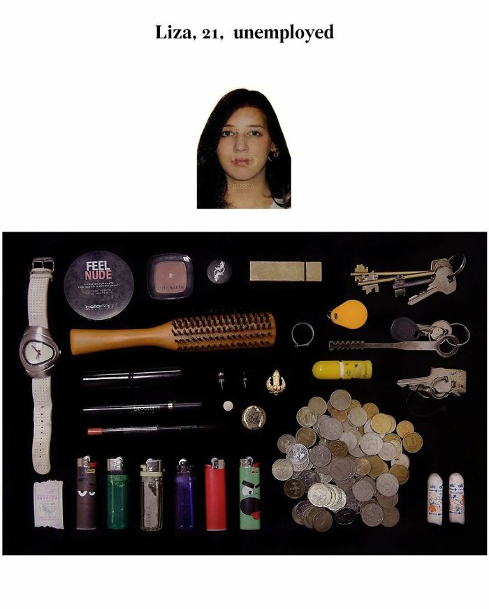 Unusual assortment of everyday items laying on a black surface, including coins, keys, and cosmetics, representing strange internet finds.