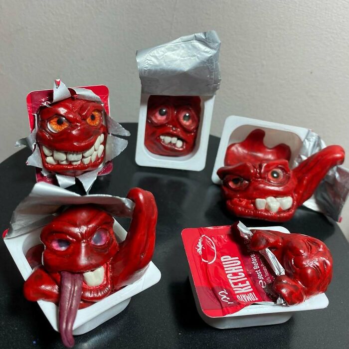 Creepy handmade crafts featuring red monstrous faces emerging from ketchup packets.