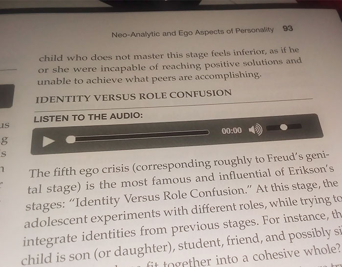 Page with design fail showing an audio player printed in a textbook under text on identity versus role confusion.