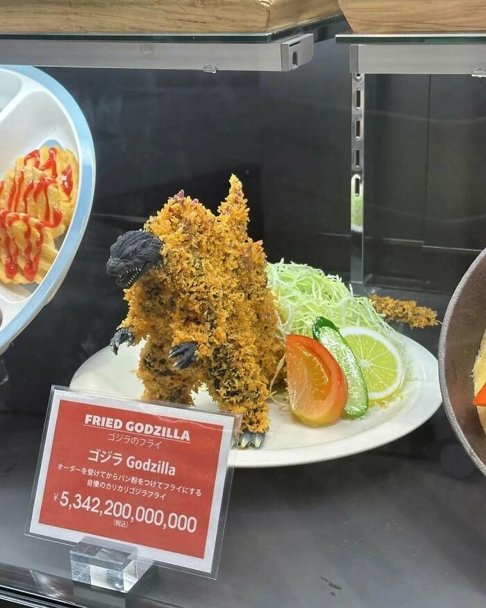 Fried Godzilla sculpture displayed in a Japanese restaurant, showcasing interesting Japan pics.