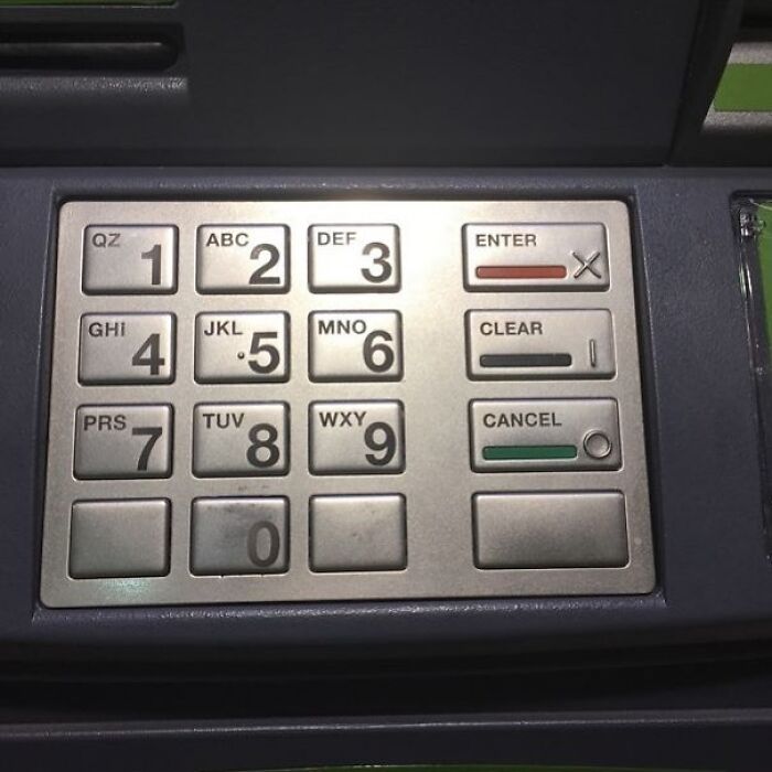 ATM keypad with design fail: misplaced and confusing button labels for enter, clear, and cancel actions.
