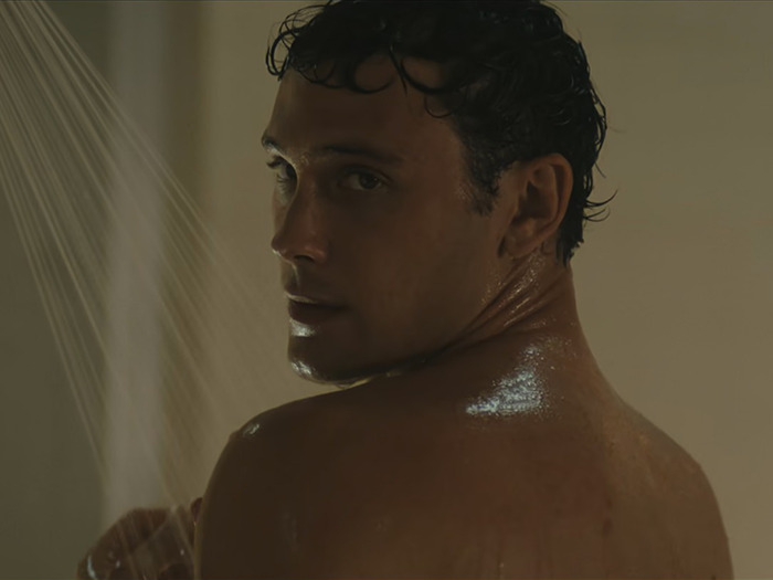 Cooper Koch in a shower scene, embracing natural look without prosthetics.