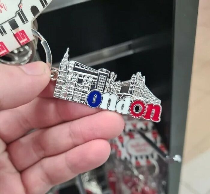 Keychain design fail with "London" misspelled as "ond on" in red, white, and blue letters.