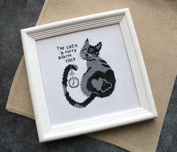 Cat-themed digital cross stitch pattern in a white frame featuring text and a clock design.