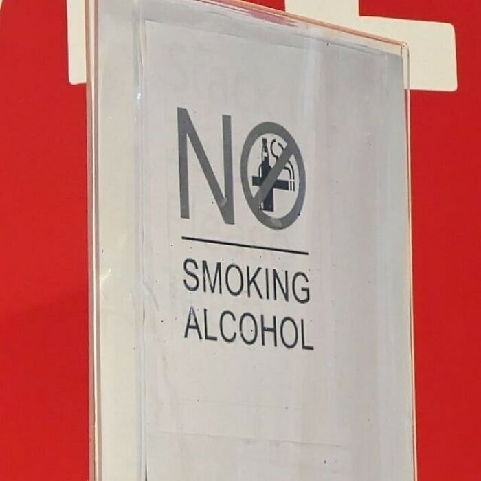 Sign displaying a confusing design message, saying "No Smoking Alcohol," showcasing a design fail.
