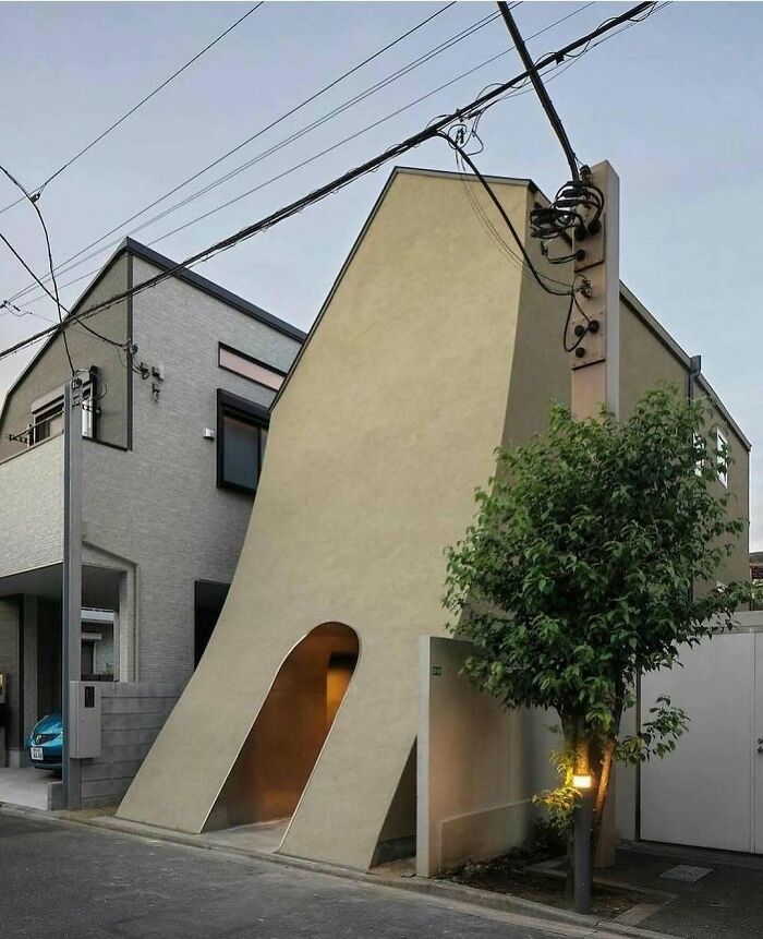 Unusual building with sloping walls, showcasing the strange side of the internet.