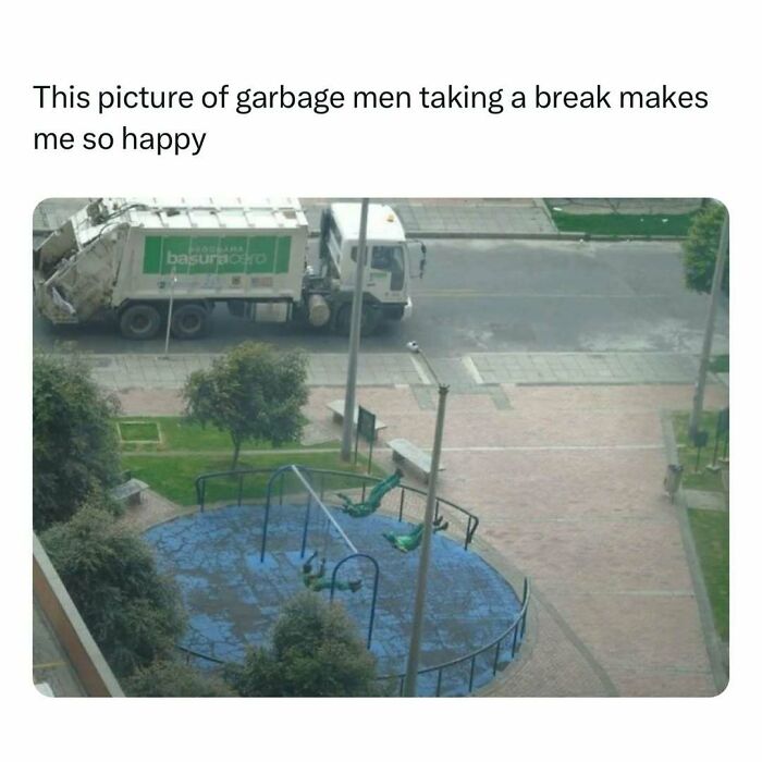 Garbage collectors taking a break beside swings, bringing joy with a heartwarming scene.