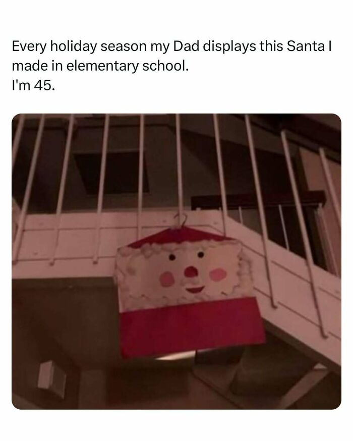 Childhood Santa craft displayed under stairs, recalling heartwarming memories.