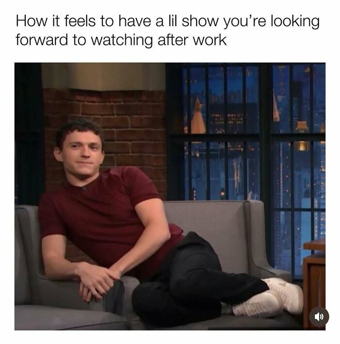 Person lounging on a talk show set, wearing a maroon shirt, captioned about anticipating a show after work. Humorous resources meme.