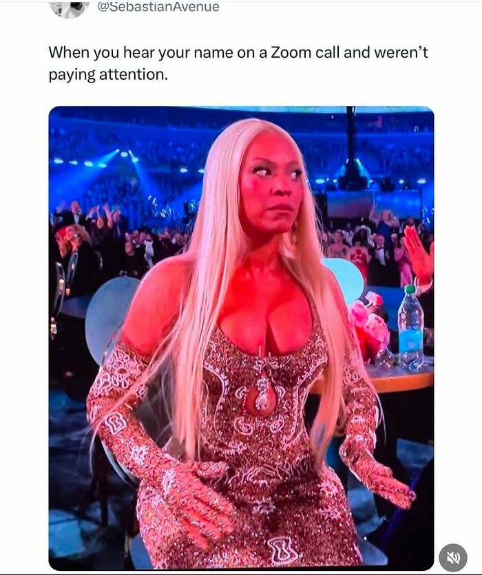 Woman in sparkly outfit at crowded event, capturing a relatable meme moment.