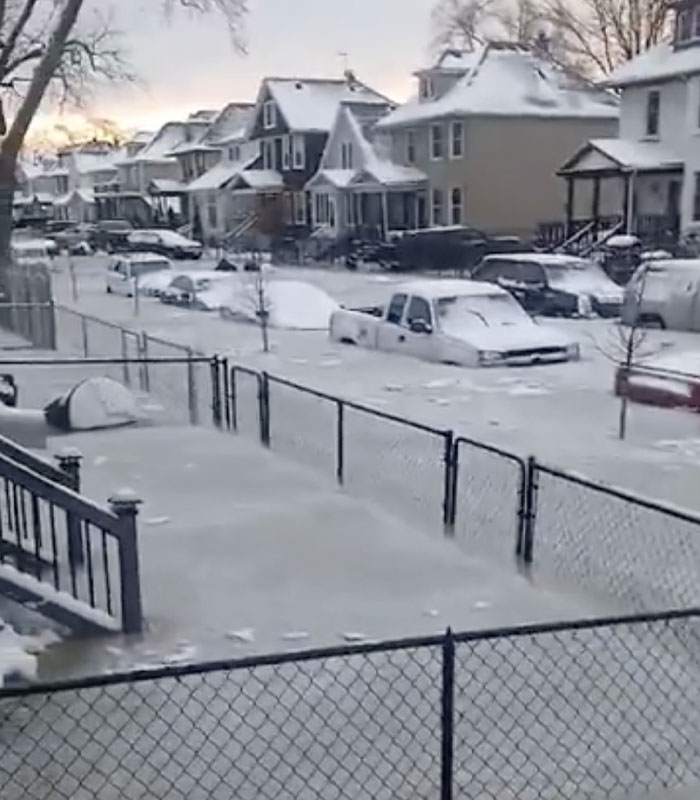 Detroit neighborhood street covered in ice after water main burst.