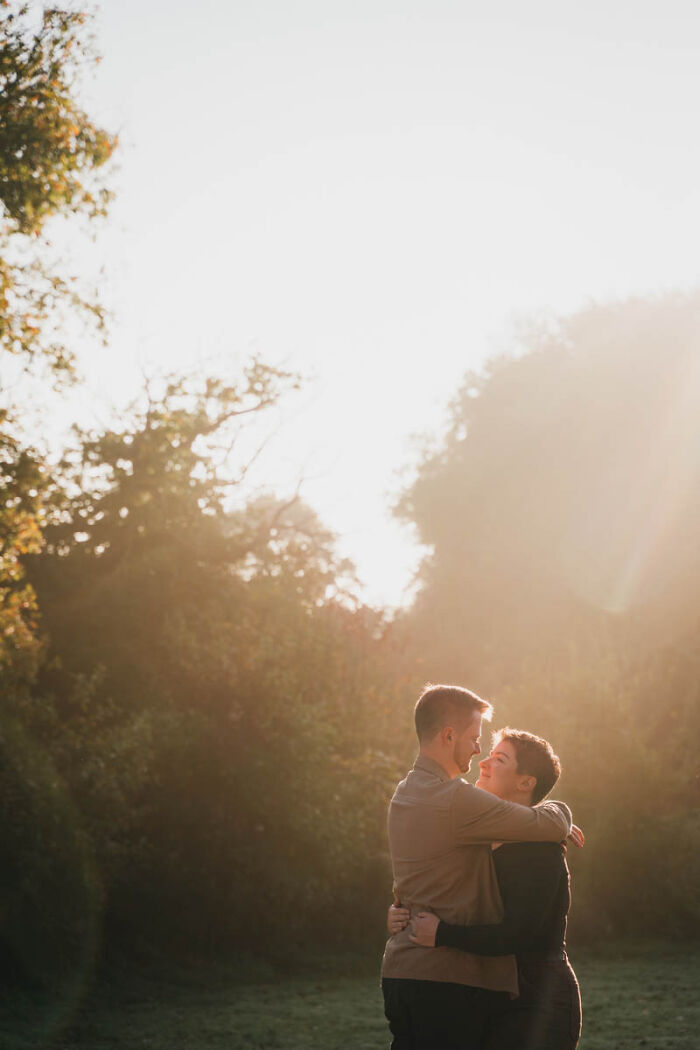 Couple embracing in sunlight, one of the best wedding photographs of 2025.