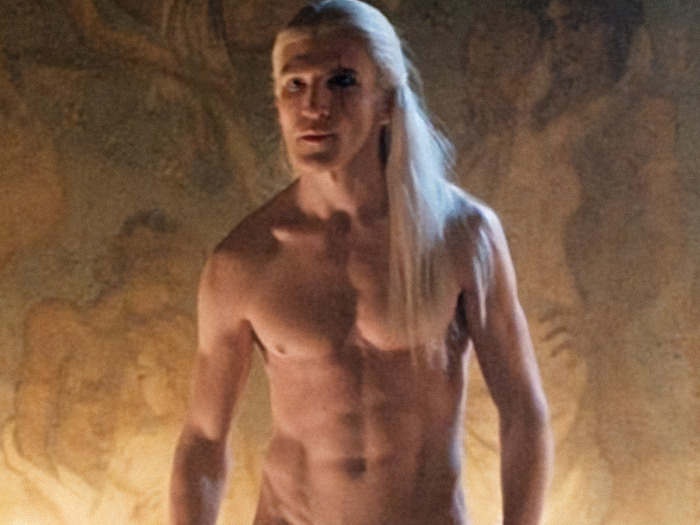 Ewan Mitchell shirtless in a fantasy setting, showcasing a natural look without prosthetics.