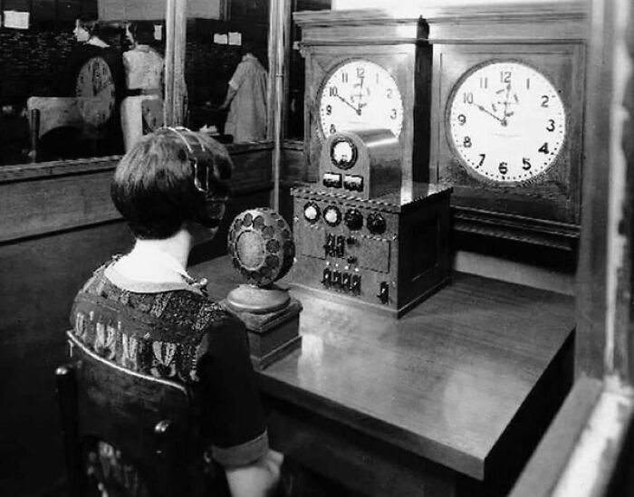 Woman operating vintage time signals in a historic job that fell by the wayside due to societal evolution and change.