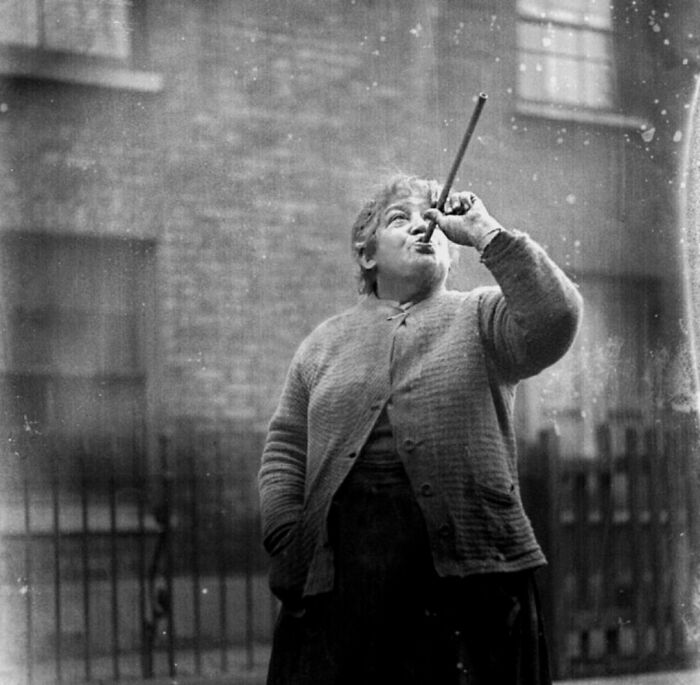 Historical job: person using a tool outdoors, illustrating jobs that died out as society evolved.