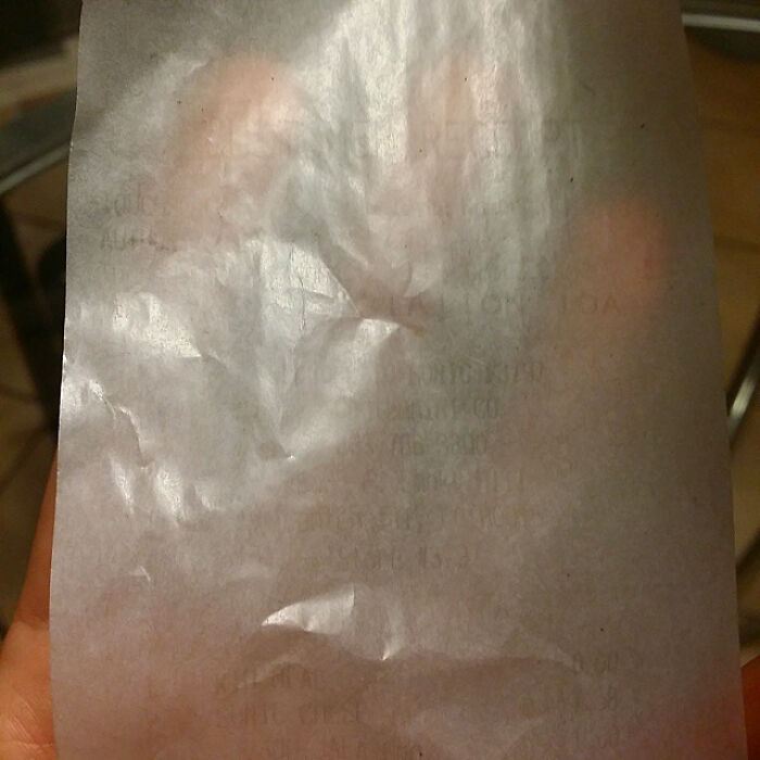 A blurry, crumpled paper receipt is shown, difficult to read details, under the topic of interesting receipts people found.