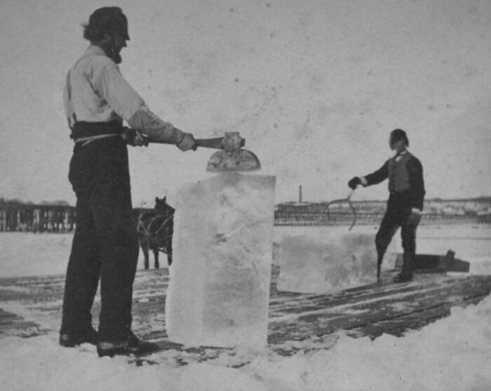 Men cutting ice blocks on a frozen lake, depicting occupations that died out as society evolved.