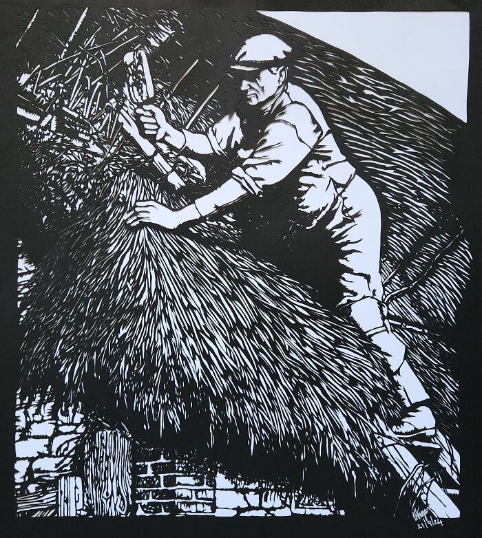 Artistic paper cutting depicting a man thatching a roof, crafted with intricate details using a single piece of paper.