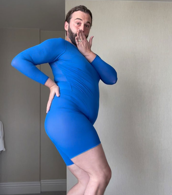 Person in a blue bodysuit striking a playful pose, highlighting drastic weight loss transformation.